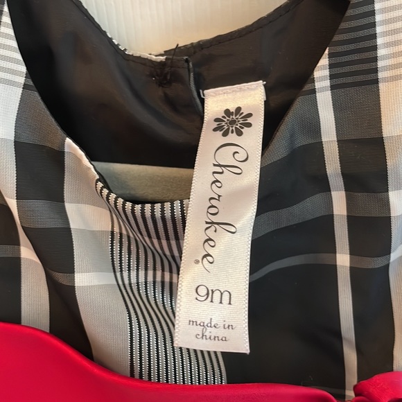 Beautiful black and white with a red sash dress - Picture 4 of 5